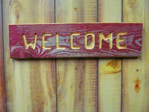 Click to enlarge image  - HANDCRAFTED WOOD SIGN - WELCOME WEATHERED RED STAIN